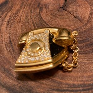 Vintage Swarovski gold colored rotary telephone with crystals.
